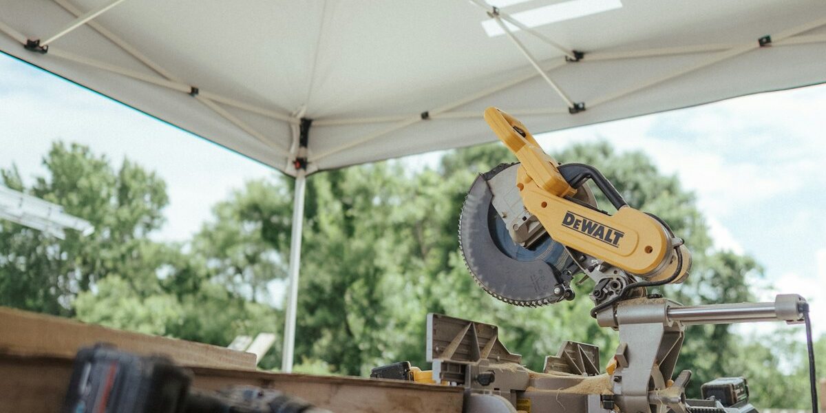 Miter saw and tools in woodworking workshop